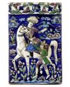 A QAJAR MOULDED POLYCHROME POTTERY TILE, PERSIA, 19TH CENTURY