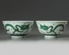 A pair of Chinese green glazed 'dragon' bowls
