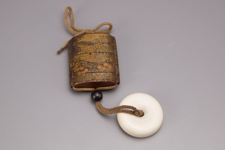 A Japanese four-case lacquered and gilded inro