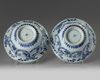 A pair of Chinese blue and white ‘floral’ klapmuts bowls