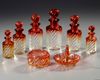 A TOILETSET OF CRANBERRY BACCARAT, CIRCA 1880