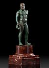 A GRECO ROMAN BRONZE STATUETTE OF HERAKLES, CIRCA 1ST CENTURY B.C. / A.D.