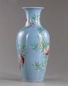 A Chinese blue-ground famille rose 'peaches' vase