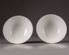 A pair of Chinese yellow-ground famille rose bowls