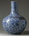 A LARGE CHINESE UNDERGLAZE COPPER RED AND BLUE AND WHITE 'DRAGON' VASE, QING DYNASTY (1644-1911)