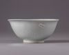 A Chinese Shufu-style white-glazed moulded 'dragon' bowl