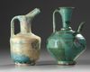 Two Islamic turquoise glazed jugs
