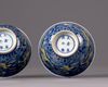 A pair of Chinese yellow-enamelled blue and white 'dragon' bowls