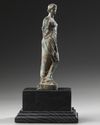 A ROMAN BRONZE STATUETTE OF APHRODITE / VENUS LEANING ON A PILLAR, CIRCA 1ST CENTURY B.C - A.D.