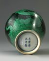 A Chinese black-ground green-enamelled 'twin dragon' meiping