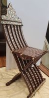 Two wooden mother of pearl inlaid chairs