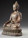 A SINO-TIBETAN BRONZE SEATED BUDDHA,  20TH CENTURY