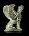 A SEATED BRONZE SPHINX, HELLENISTIC, 1ST-2ND CENTURY BC