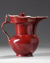A CHINESE RUBY-RED GLAZED MONK'S CAP EWER