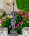 A DUTCH CAST ZINC FIGURE OF A PUTTO HOLDING A TORCHERE, 19TH CENTURY, STAMPED ADRIANUS GODSCHALK