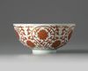 A Chinese iron-red and gilt-decorated ‘lotus scroll’ bowl