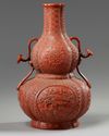 A Chinese imitation-cinnabar-lacquer double gourd vase