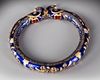 A GEM-SET ENAMELLED GOLD BANGLE, (KADA) NORTH INDIA 19TH CENTURY