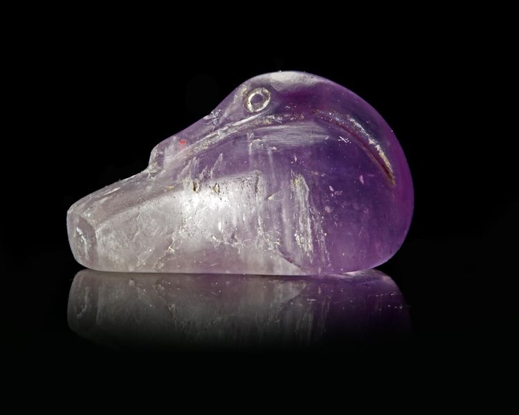 A WESTERN ASIATIC AMETHYST DUCK WEIGHT, CIRCA 2ND-1ST CENTURY B.C.