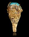 A TURQUOISE SEAL GOLD RING