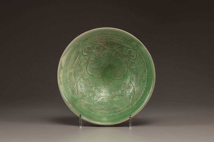A CHINESE YAOZHOU CARVED GREEN GLAZED CONICAL BOWL, LIAO DYNASTY (907-1125)