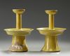A pair of Chinese yellow-glazed candlestick holders