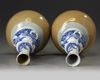 A pair of Chinese café-au-lait-glazed blue and white triple gourd vases