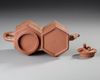 A CHINESE DOUBLE HEXAGONAL YIXING TEAPOT, 19TH CENTURY