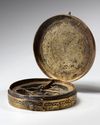 A GILT PERSIAN 'QIBLA' INDICATOR, FOR FINDING MECCA