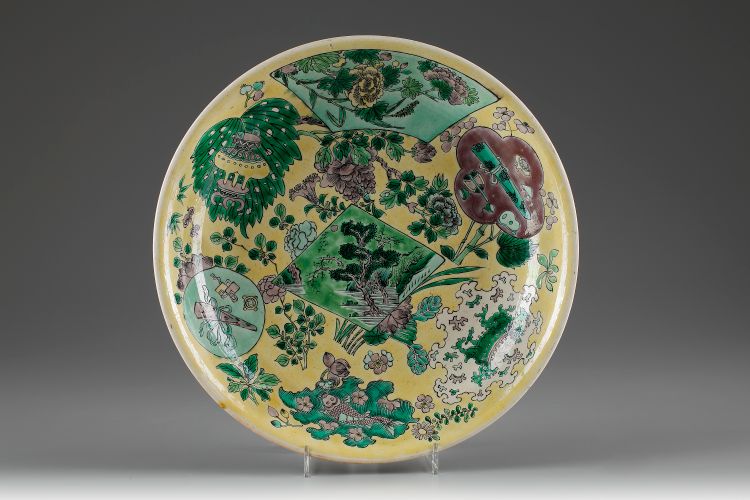 A yellow-ground green and aubergine-decorated biscuit plate