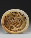 A Chinese white and russet  jade 'birds' openwork carving