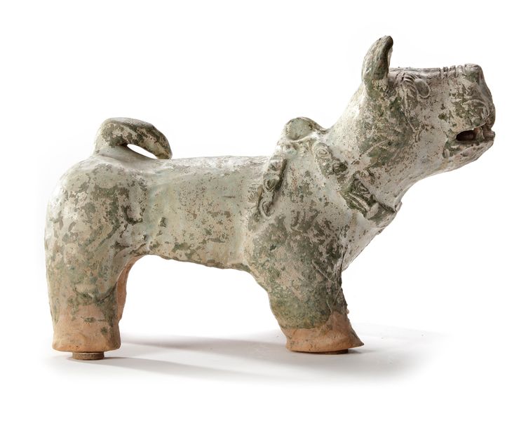 A CHINESE GREEN-GLAZED POTTERY DOG, HAN DYNASTY (206 BC-220 AD)