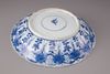A blue and white porcelain plate with floral decorations