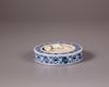 A Chinese blue and white circular inkstone