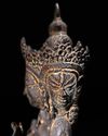 A SINO-TIBETAN BRONZE FIGURE OF THREE-HEADED SEATED BODHISATTVA