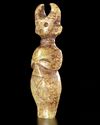A GREENISH-YELLOW JADE CARVING OF A HORNED STANDING FIGURE, CHINA, HONGSHAN CULTURE