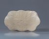 A Chinese white-glazed 'boy' pillow