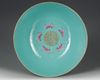 A  LARGE FAMILLE ROSE GREEN-GROUND BOWL DAOGUANG SIX-CHARACTER SEAL MARKS IN IRON RED AND OF THE PERIOD (1821-1850)