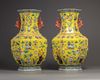 A pair of Chinese yellow-ground appliqué-decorated octagonal vases