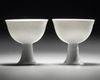 A PAIR OF CHINESE WHITE-GLAZED DRAGONS STEM CUPS, 20TH CENTURY