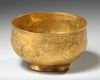 A PERSIAN GILT COPPER BOWL