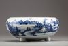 A blue and white tripod censer