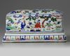A Chinese wucai 'figural' box and cover