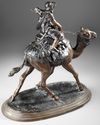 A BRONZE FIGURE OF A RIDER ON CAMEL, 19TH CENTURY