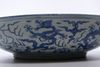 A LARGE CHINESE BLUE AND WHITE DRAGONS DISH, MING DYNASTY (1368-1644) OR LATER