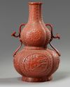 A Chinese imitation-cinnabar-lacquer double gourd vase