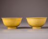 A pair of Chinese yellow-glazed ‘dragon’ bowls