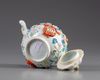 A Chinese famille rose moulded teapot and cover