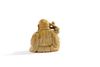 An ivory carving of Budai