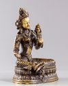 A Tibetan gilt bronze figure of the green Tara, Syamatara